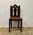 A striking antique English Gothic Revival chair, rich with the architectural spirit that defined the Gothic revival...