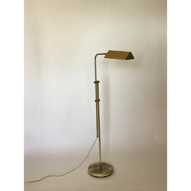 Timeless and refined, this vintage brass reading lamp features a distinctive double-rod design and an elegant, tarnished...