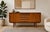 Stunning Mid Century Modern teak credenza handcrafted in Scandinavian style. This timeless piece features a sleek,...