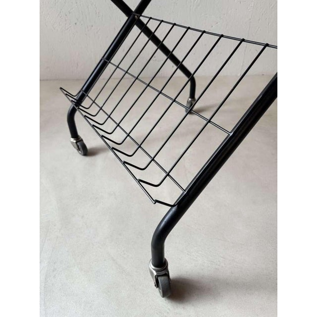 A rare Scandinavian vintage side table model, fully renovated in our workshop and ready for use. The combination of teak,...