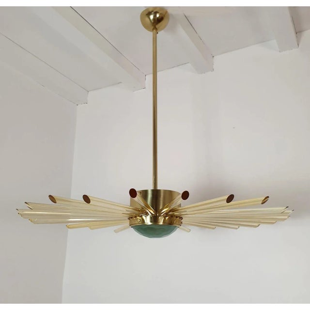 Large Mid Century Modern Sputnik chandelier, Italy 1980s. The Mid Century Sputnik chandelier is made of a polished brass...