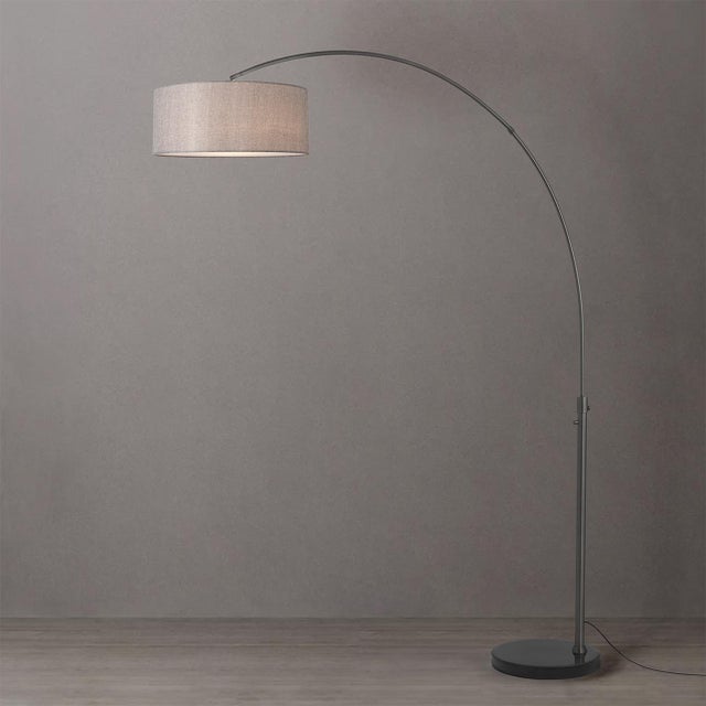 The Float Arc Lamp is a Modern arc lamp designed by Peter Morelli in 1960. It features a sleek black nickel steel body and...