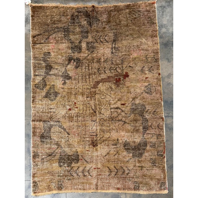 This distinctive antique Samarkand rug, dating to the early 20th century, features an exceptionally unusual pictorial...