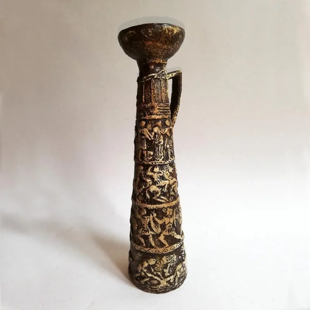 This large brown and white ceramic candlestick comes in the shape of a column. It was produced by Bitossi.