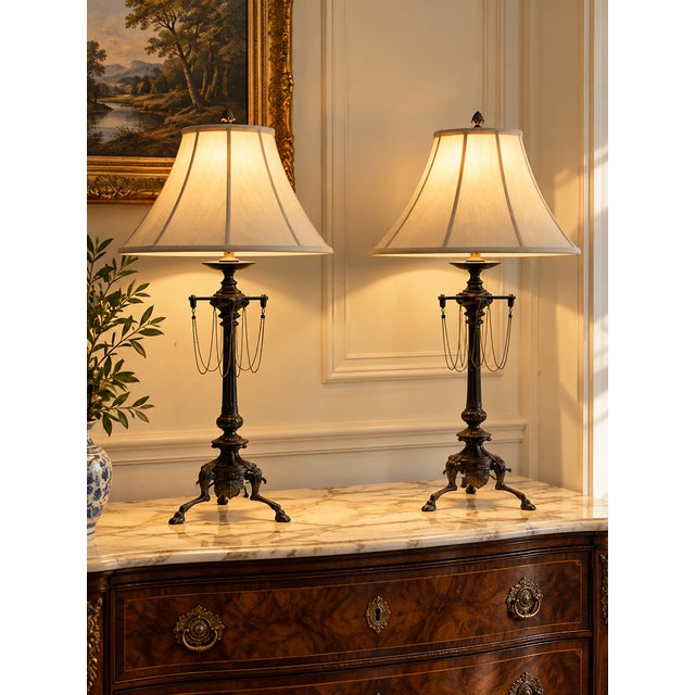 This vintage pair of French Empire Revival table lamps showcases the stately proportions and classical detailing...