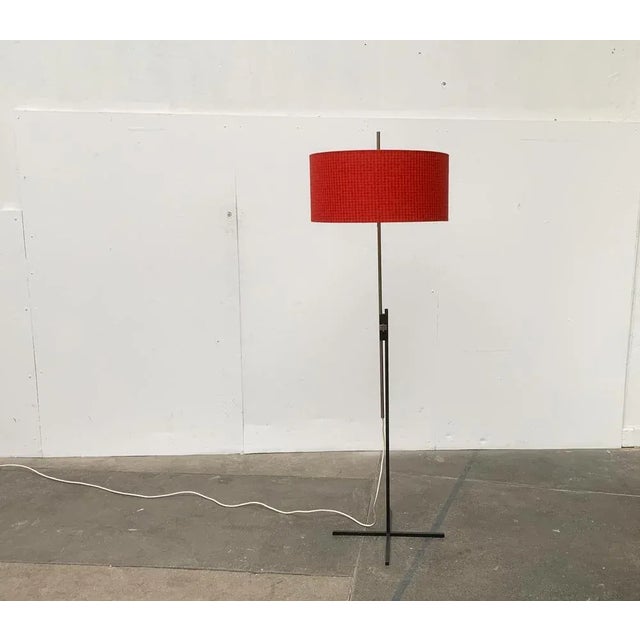 Rare mid century floor lamp from kaiser leuchten with a special minimalist base. the special detail of this lamp is the...