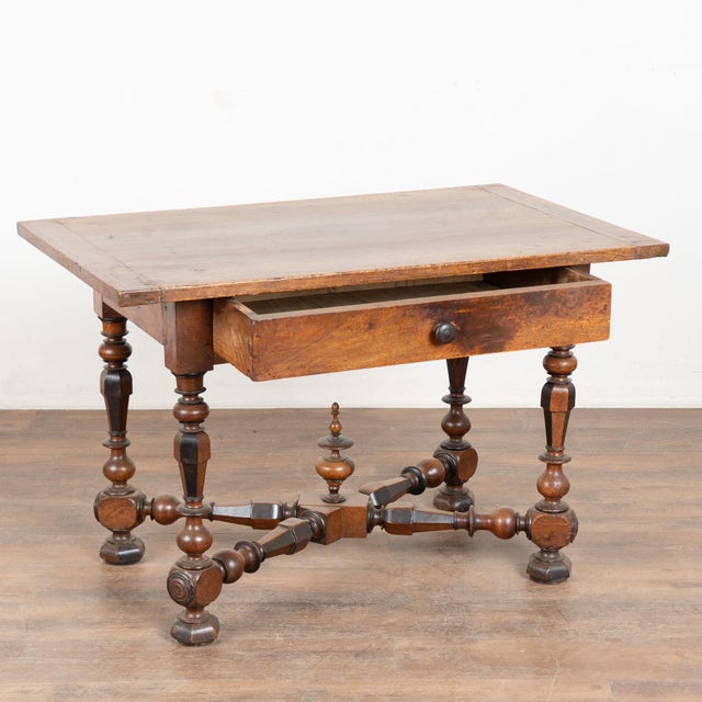 19th century Danish side table with single drawer, crafted in oak and other woods combined. The base has a striking...
