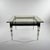 A Modernist square cocktail table with curiously shaped legs from Italy circa 1960.