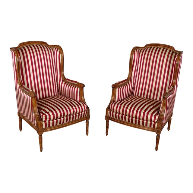 Early 20th Century French Louis XVI Style Walnut Bergères à Oreilles with Fluted Legs - A Pair For Sale