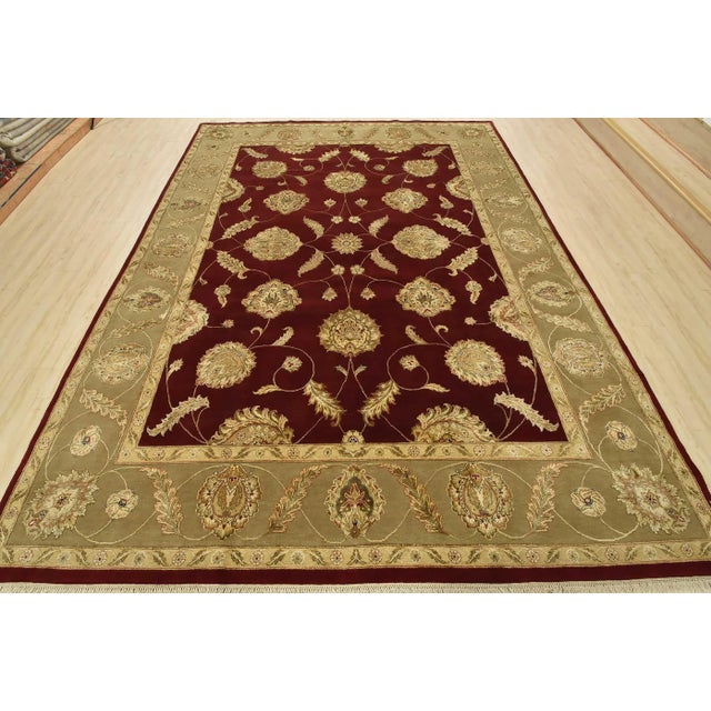 This traditional Agra rug is hand-knotted with a fine wool and silk pile on a cotton foundation. This rug is new and in...