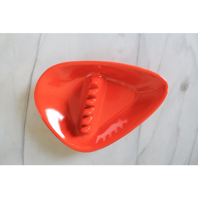 Vintage bright orange melamine boomerang ashtray, made by Anholt in the mid-20th century. Makers mark on bottom. Small...