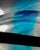 Murano glass vase with a globular body in clear glass, featuring light blue and black inclusions inside, a typical...