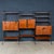 An impressive Italian modular wall storage and shelving system dating from the 1960s, combining warm teak cabinetry and...