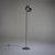 Floor lamp in chromed metal with a spherical shade mounted on a slender smooth stem and slightly domed base. Labeled on...