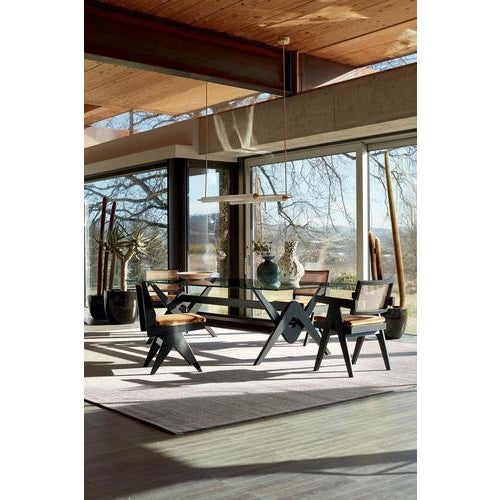 Introducing the Pierre Jeanneret 056 Capitol complex dining set, a timeless design that exudes elegance and...