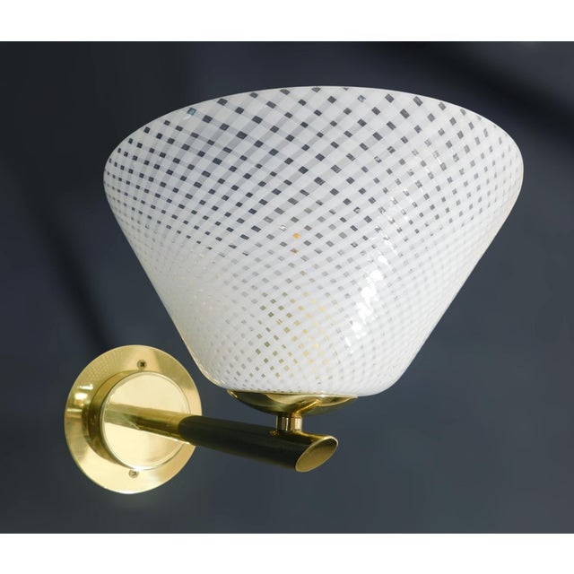 Vintage Italian wall light with Murano glass cup hand blown in "reticello" technique to form crisscross pattern of white...