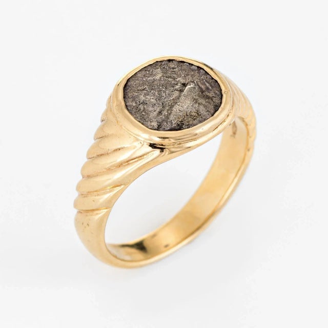Stylish vintage Bulgari ancient coin ring crafted in 18 karat yellow gold (circa 1970s to 1980s). The iconic coin ring was...