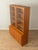 Classic two-part display cabinet from the 1960s. Teak veneer body with two glass doors, two solid doors, eight shelves,...
