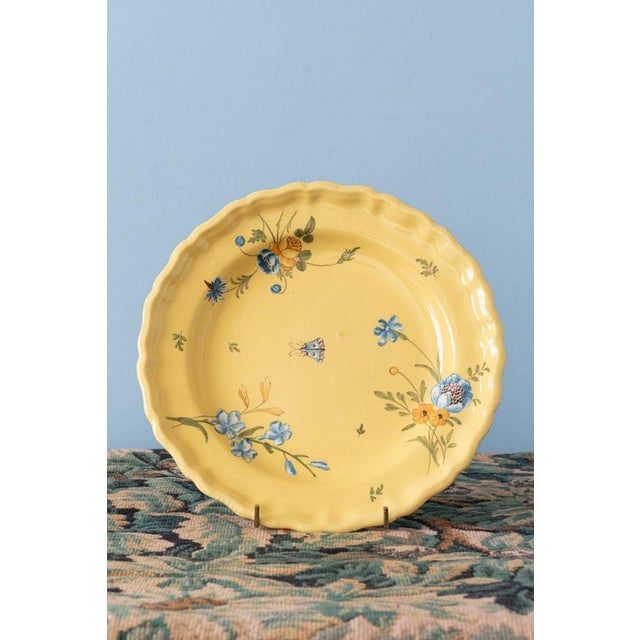 A trio of French faience plates from Marseille, produced by the Manufacture Fauchier, c. 1760. Each plate is decorated on...