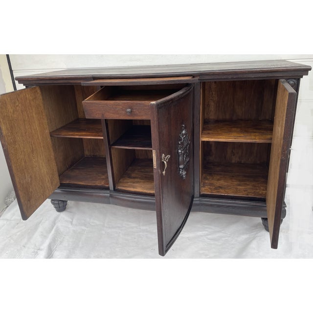 An impressive, highly decorative sideboard executed in a European historicist style, blending distinct Neo-Renaissance and...