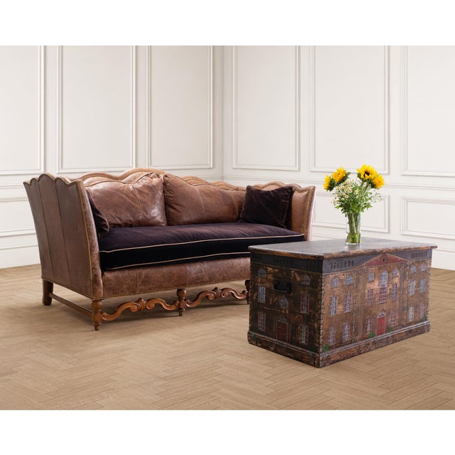 A handsome leather and walnut sofa crafted in a Country style designed by "Double R Leather" in Hickory, North Carolina....