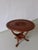 Vintage solid teak wood side table with carved tabletop and sculptural base.
