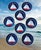 A great vintage set of 8 plates nautical themed design with a stylized red and white sailboat centered on a deep blue...