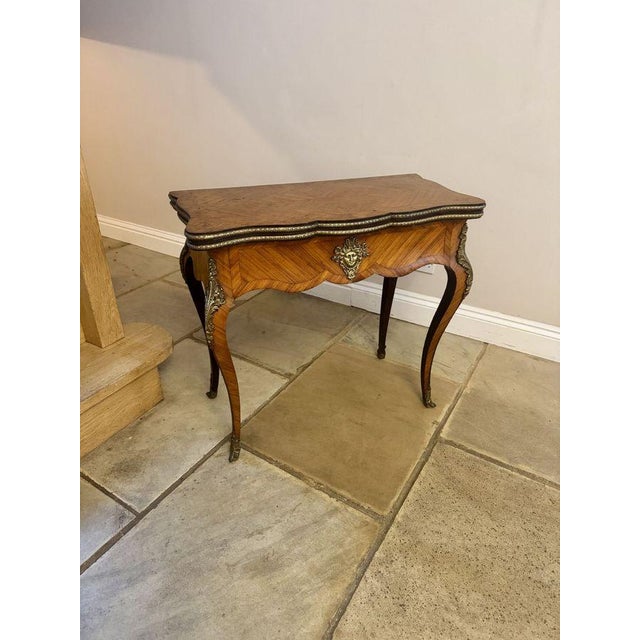 Quality 19th Century French Kingwood and cross banded card table, having a quality 19th century French card table with a...