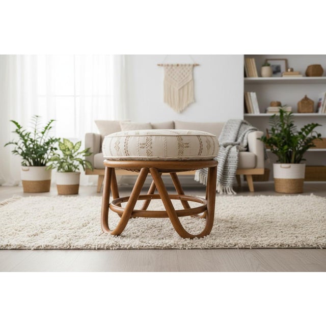 A charming vintage 1970s rattan round ottoman, beautifully woven with natural texture and that classic...