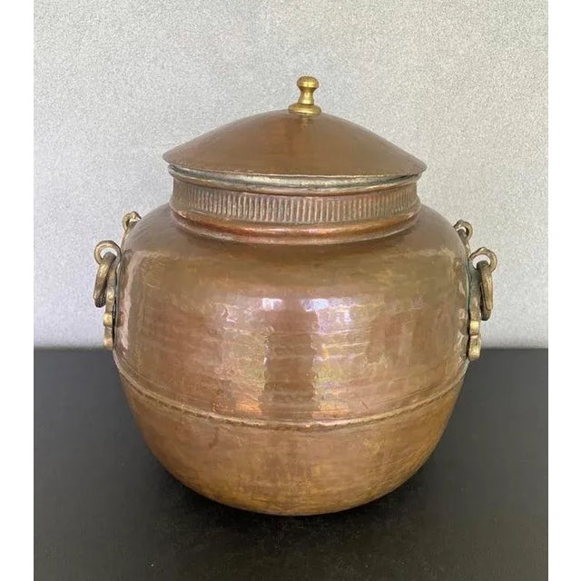 Amazing large antique handmade hammered cauldron/ lidid pot, has heavy ornamental brass handles on each side. Beautiful...