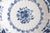 A gorgeous vintage Dutch Delft faience floral scalloped wall charger plate by Royal Tichelaar Makkum, circa 1940. Maker's...