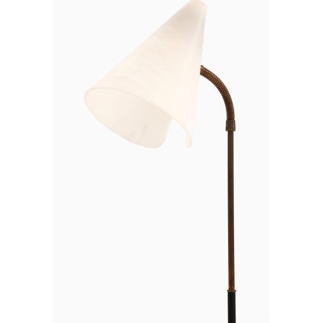 Rare floor lamp in black lacquered metal, brass and white plastic, 1950’s additional information: material: black...