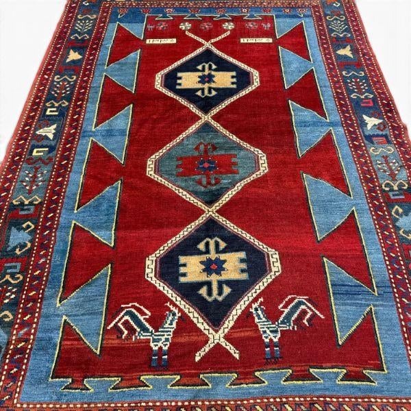 This striking antique Kazak rug is full of the bold geometry, saturated color, and expressive motifs associated with...
