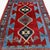 This striking antique Kazak rug is full of the bold geometry, saturated color, and expressive motifs associated with...