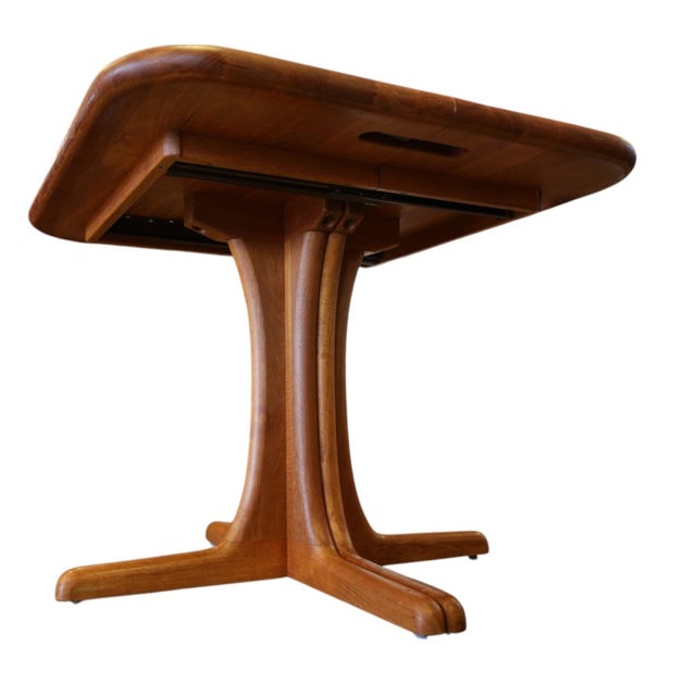 A stylish and very well-made Danish dining table in solid teak with unusually neat dimensions of only 90 × 90 cm. The...