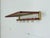 This beautiful wall-mounted coat rack is for sale, captivating with its elegant combination of anodized metal in a...
