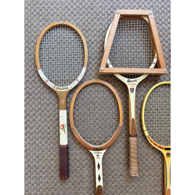 Five midcentury vintage tennis rackets, one with wooden press. Great wall decor for game room. Please see condition...