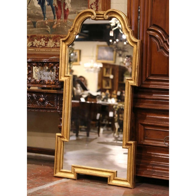 Dress a mantel with this elegant antique gilt wall mirror. Hand carved in Italy circa 1950, and almost 5 feet tall, the...