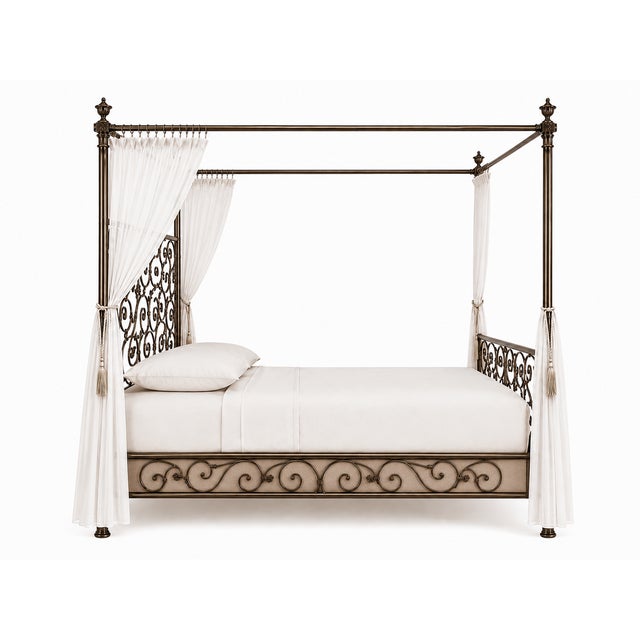 This ornate bronze canopy bed features intricate scrollwork detailing. Eastern King 80W 84D 96H 57HB Make a grand...