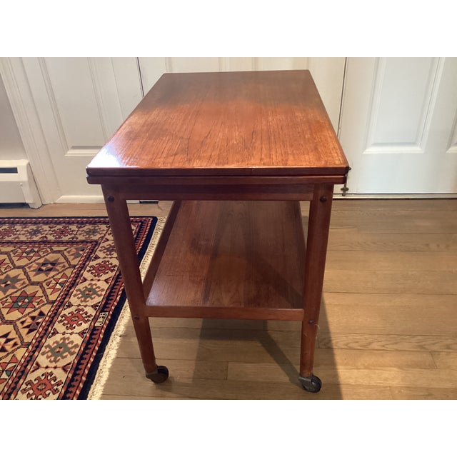 1970s Midcentury Modern Teak Rolling Expandable Table With Shelf For Sale - Image 4 of 12