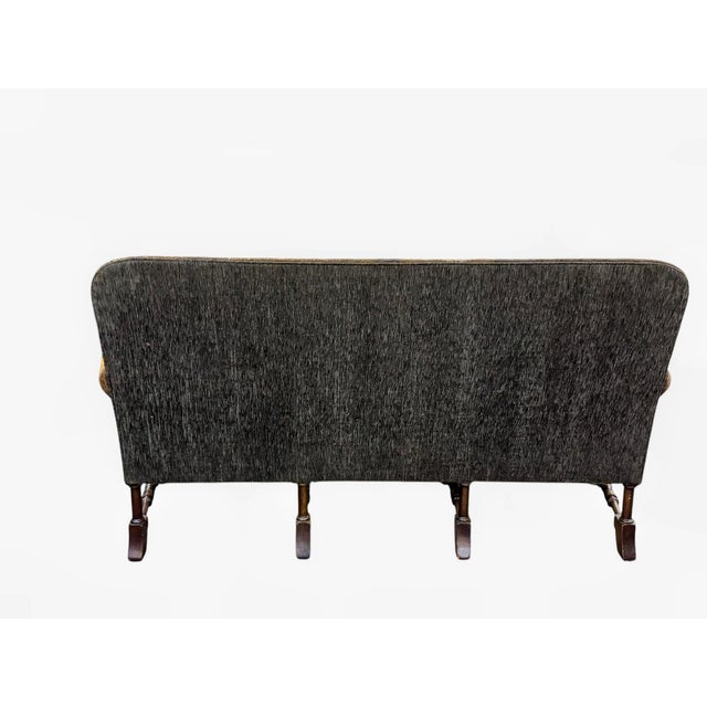 Ornate settee with a hand-stitched needlepoint tapestry back and arms. The upholstery features a detailed pastoral scene...