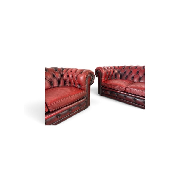 Genuine leather with deep button tufting. Traditional Chesterfield with rolled arms and studded detailing One three-seater...
