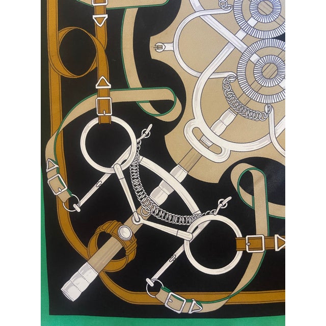 HERMES Golden Spurs 1989 Gavroche Silk Scarf This scarf depicts the golden spur, the metal piece attached to the rider's...
