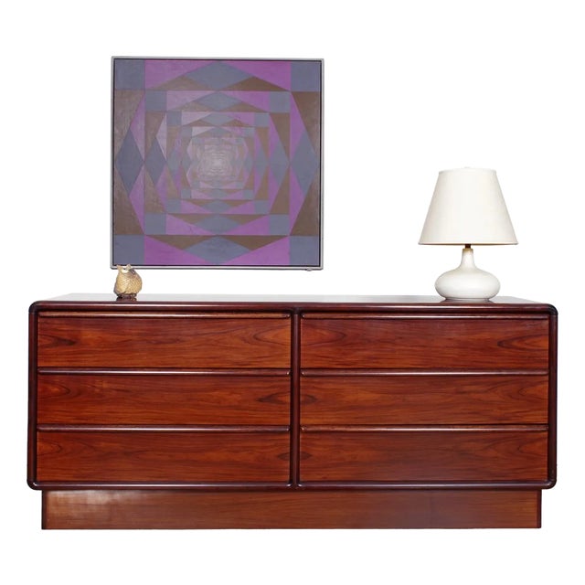- A six drawer dresser in gorgeous rosewood with rounded corners - A sculpted pull runs the top length of each drawer -...