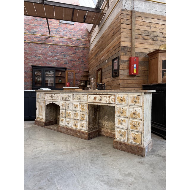 This early 20th-century barber’s cabinet has been fully restored. It features 5 medium-sized drawers and 20 small drawers,...