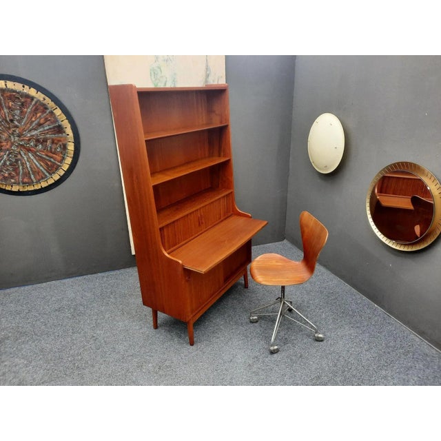 Beautiful office secretary with sliding doors and shelves. It has sliding doors at the bottom and two small roller...