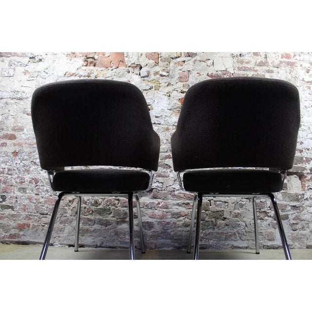 Set of 2 dining chairs in dark brown wool upholstery. with a chrome base. Can also be used as armchairs due to the...