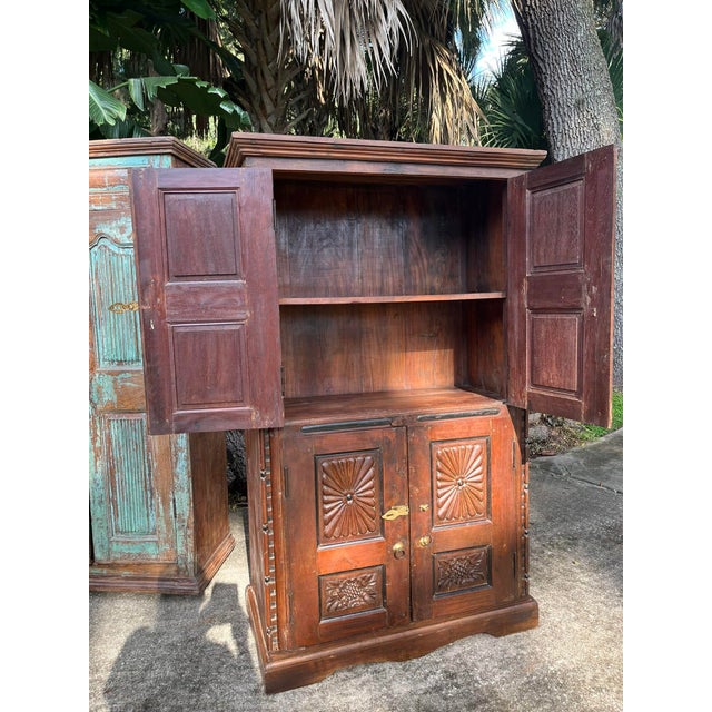 Bring timeless character and artisan craftsmanship into your home with this antique Indian armoire, beautifully...