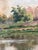 An antique original oil painting of a countryside cottage landscape, dating from around 1925. The painting shows a...