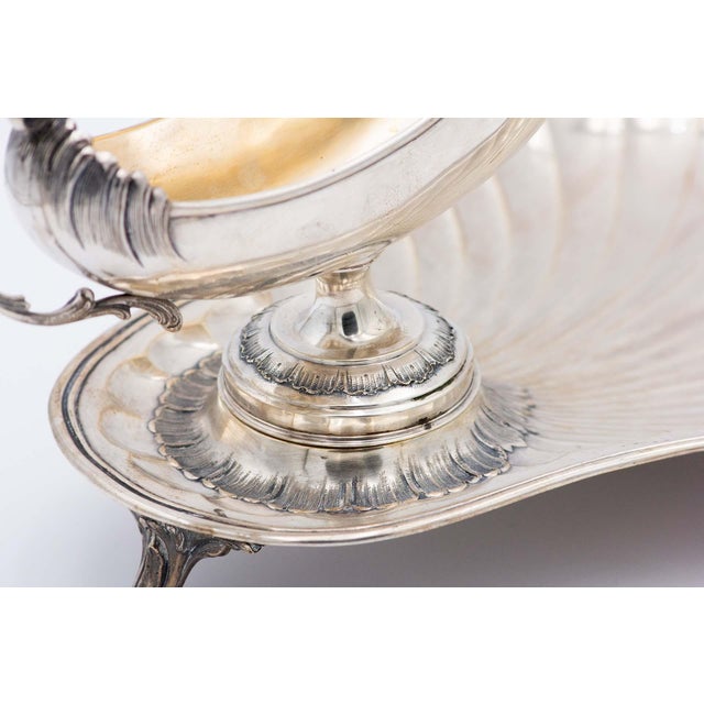 Spaceship-Shaped Silver Sauce Boat with Raised Handle and Gummed Plate, in Very Good conditions. Designed 1890 to 1919...